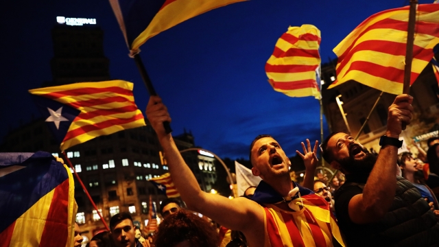 Protesters hold Catalonia's flag