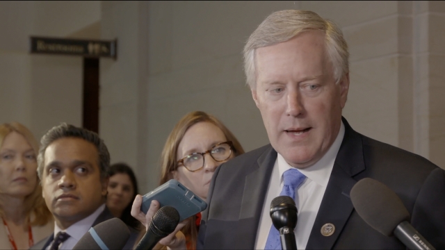 U.S. Rep. Mark Meadows talks with reporters following a vote to pass a House resolution on impeachment.