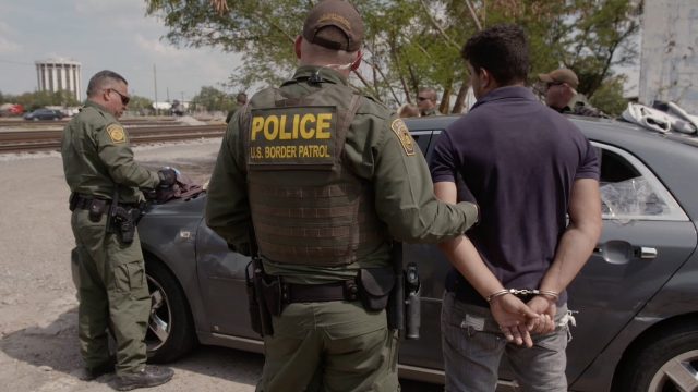 U.S. Customs and Border Protection agents arrest a migrant