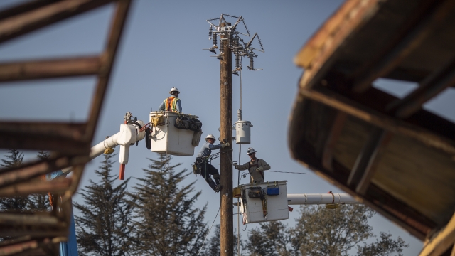 Pacific Gas and Electric Company crews work to restore power