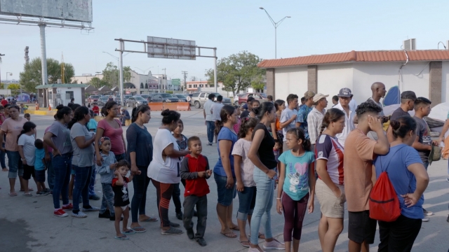 Migrants wait in Mexico near the U.S.-Mexico border