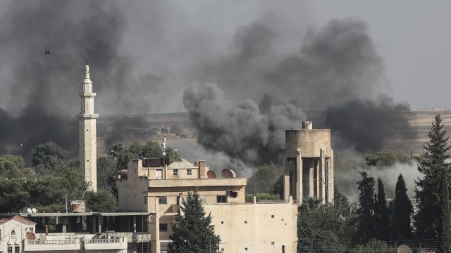 Smoke rises over the Syrian town of Ras al-Ain.