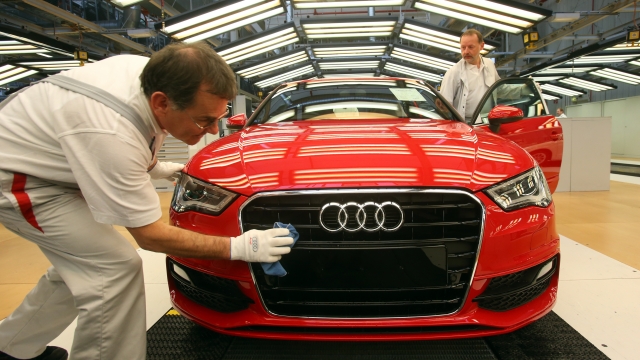 Workers with an Audi A3