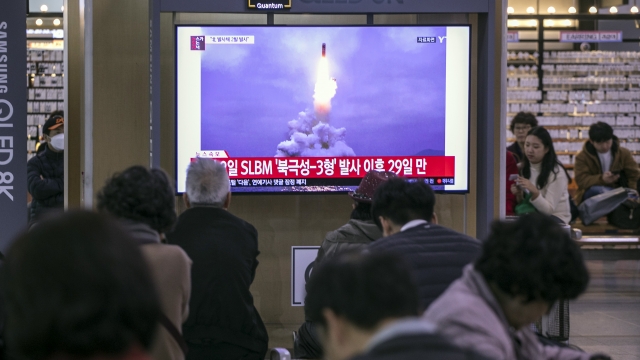 People watch a broadcast reporting the N. Korean missile launch at the Seoul Railway Station on October 31st.