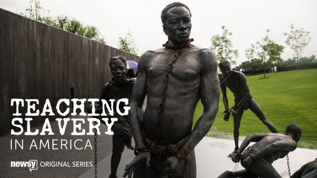 A sculpture commemorating the slave trade greets visitors at the entrance National Memorial For Peace And Justice