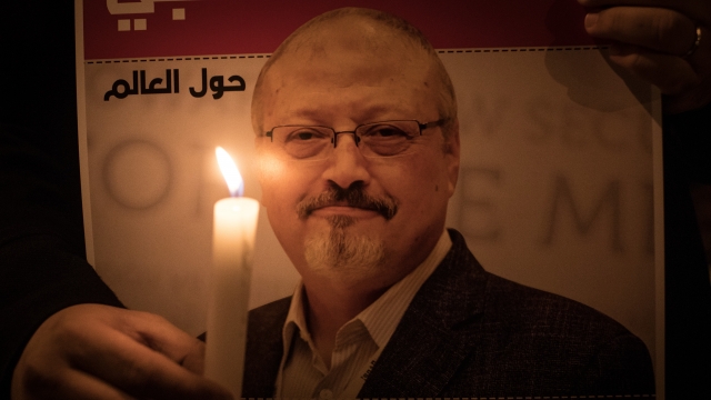 People take part in a candle light vigil to remember journalist Jamal Khashoggi
