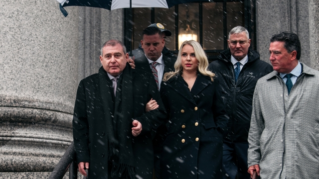Lev Parnas and his wife exit a New York courthouse