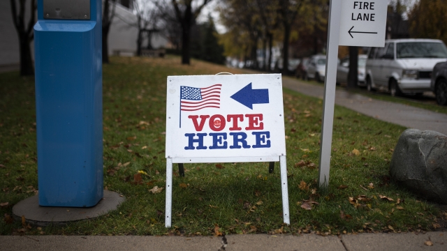 Signage directs voters towards a polling place