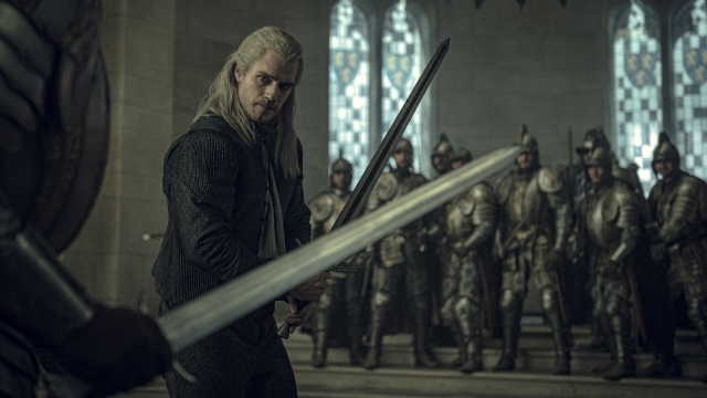 "The Witcher" character readies for battle with swords