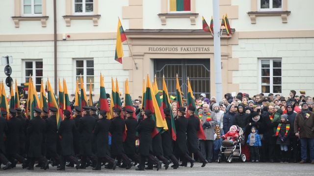 People carrying Lithuanian flags during national celebration