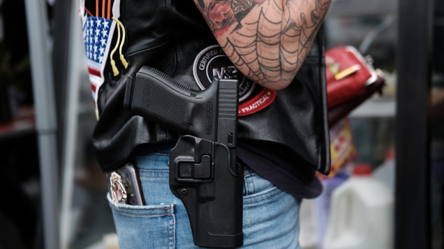 Person wearing a holstered gun