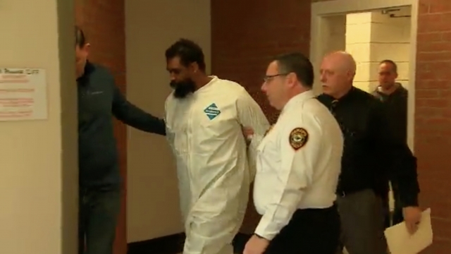 Man charged in stabbing enters court