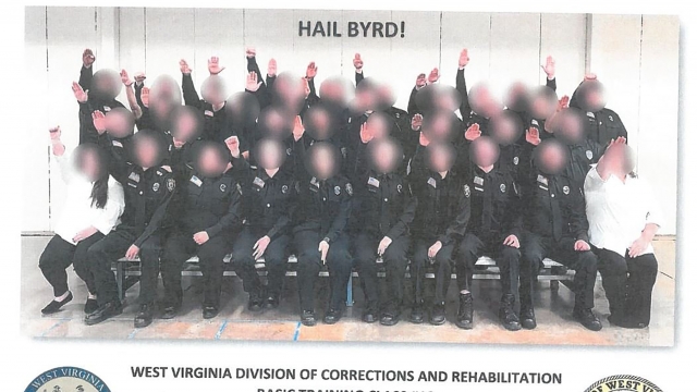 A class of trainees giving what appears to be a Nazi salute