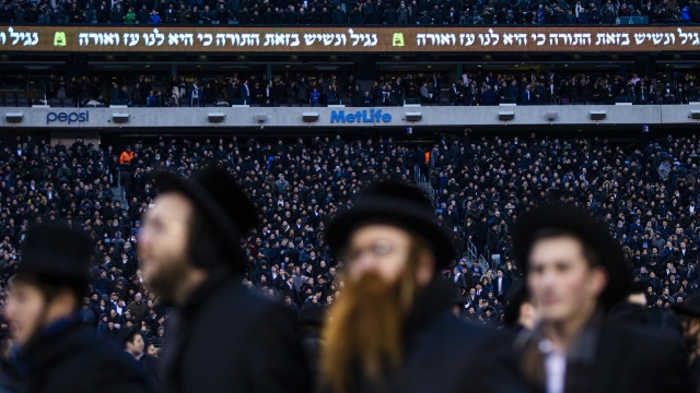 Orthodox Jews sing and dance during the 13th Siyum HaShas, a celebration marking the completion of the Daf Yomi