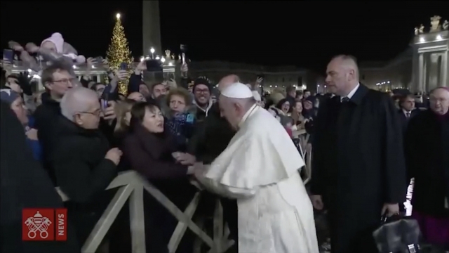 Still from video of Pope Francis with worshipers