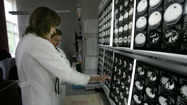 Doctors review cancer scans