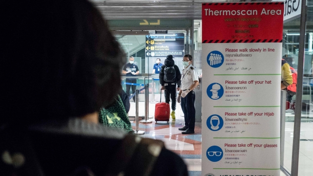 Passengers from Wuhan China are run through thermal scans in Bangkok Thailand because of the pneumonia outbreak