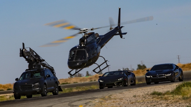 Helicopter flies above cars used for "Fear The Walking Dead"