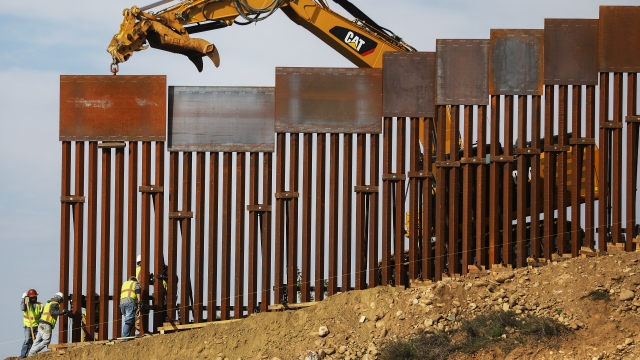 Crews construction a portion of the border wall