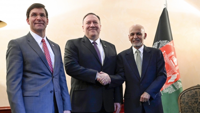 U.S. Secretary of State Mike Pompeo shakes hands with Afghan President Ashraf Ghani
