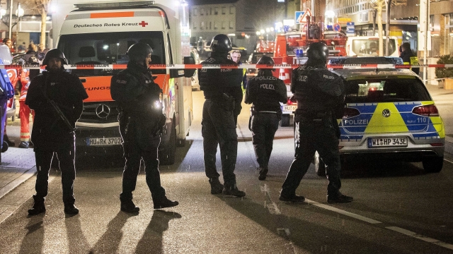 Authorities investigate the scene of a shooting in Hanau, Germany