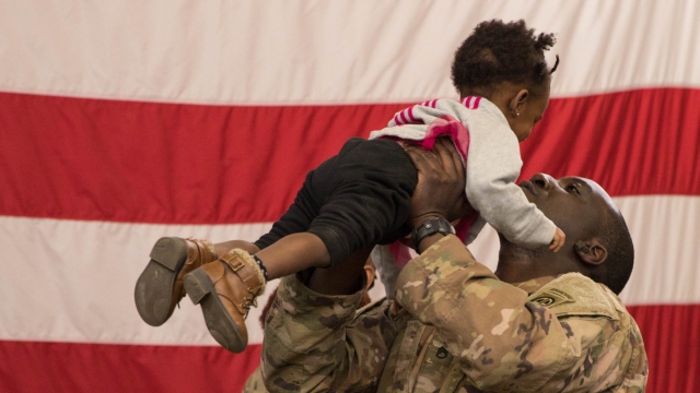 Soldier holds his daughter