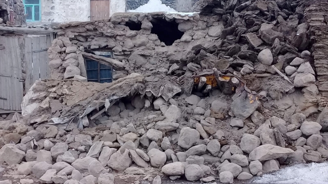 Houses are reduced to rubble after an earthquake hit villages in Baskale in Van province, Turkey, at the border with Iran