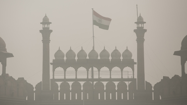 A file image of the Indian flag obscured by smog