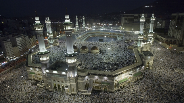 Muslim pilgrims attend the evening prayers inside the Grand Mosque