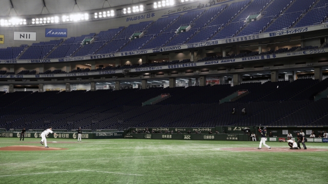 Japanese baseball players in an empty stadium