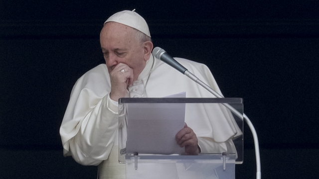 Pope Francis coughs during the Angelus noon prayer