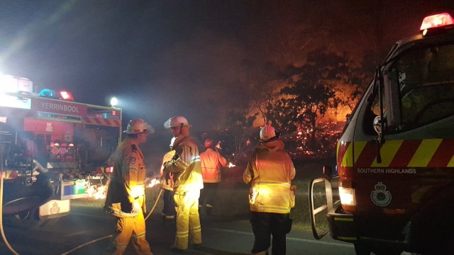 Fire crews work to put out a bushfire in Australia