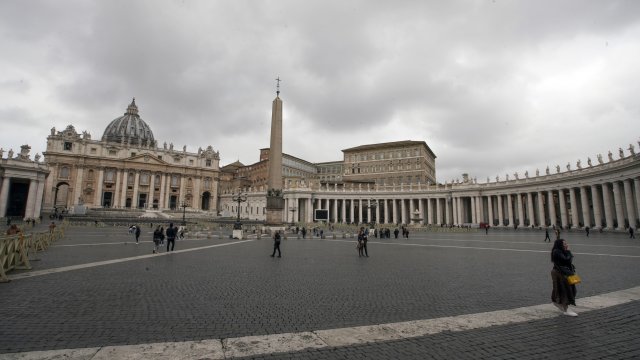 Tourists walk around in St. Peters Square