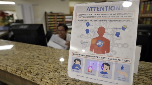 An infection Control Protocol poster sits on a nursing station desk