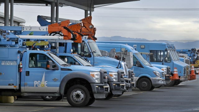 A row of Pacific Gas & Electric vehicles