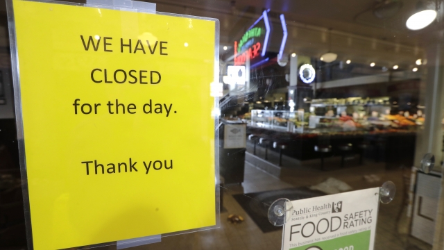 Closed sign on door to a restaurant