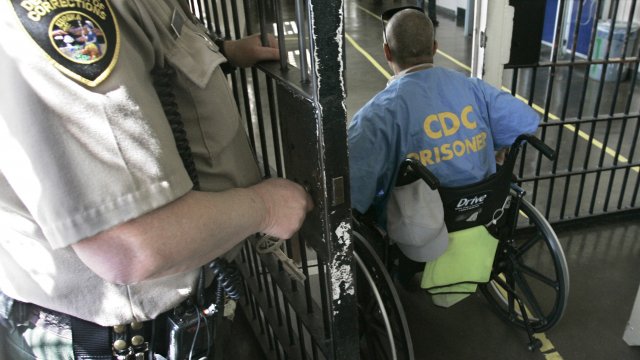 wheelchair bound inmate wheels himself through a check point at the California Medical Facility