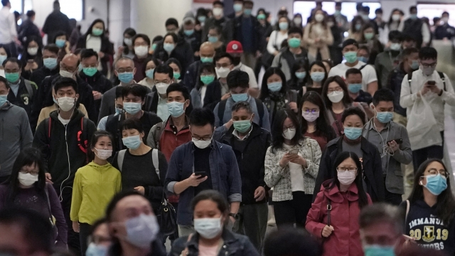 People wearing masks as a precaution against the COVID-19 illness in Hong Kong