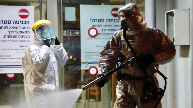 Israeli firefighter spraying disinfectant