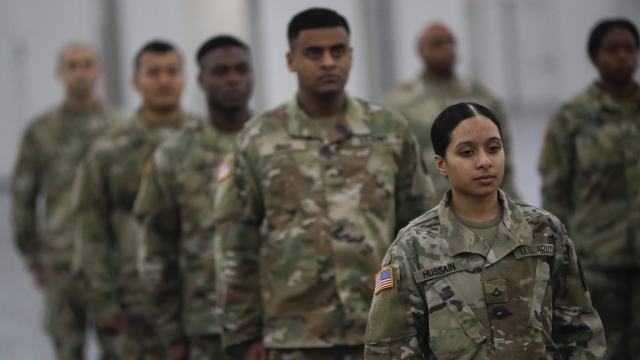The National Guard stands in formation at the Jacob K. Javits Convention Center in New York City