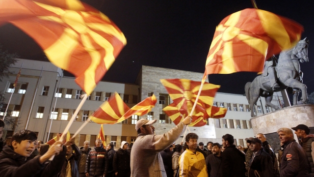 People waving North Macedonian flags