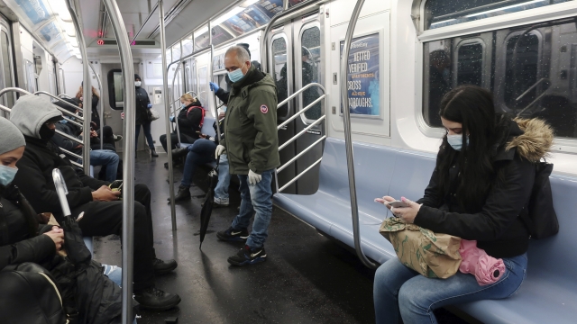 Subway passengers wearing masks