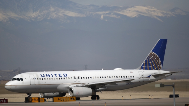 United Airlines jet parked on a runway