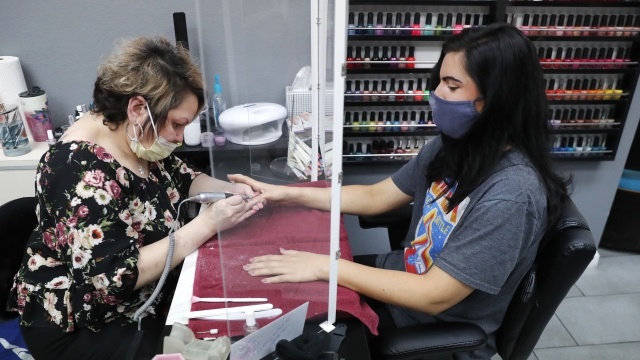 Manicurist with a customer