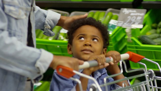 Child Walks Through Grocery Store