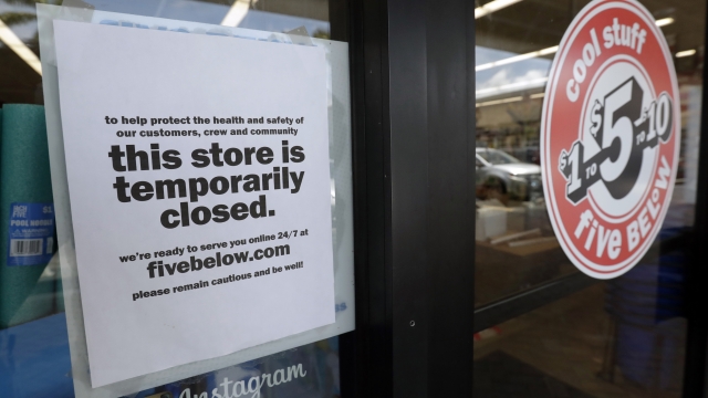 A sign tells customers the store is temporarily closed due to COVID-19.