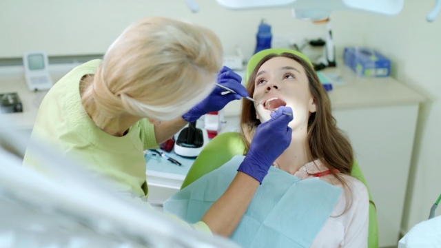 A person gets their teeth cleaned.