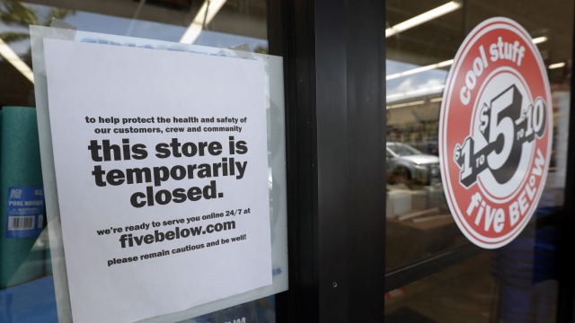 A sign is posted on a closed store in North Miami, Florida.