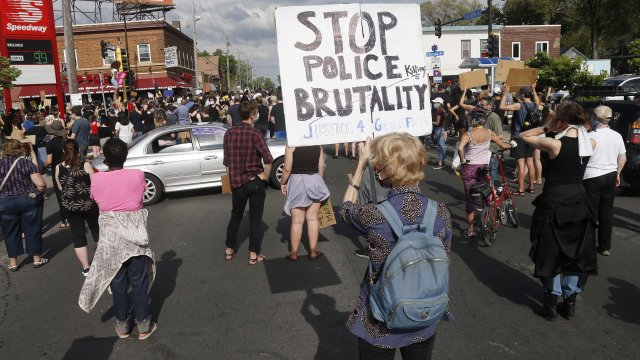 Hundreds of protesters gather Tuesday, May 26, 2020 near the site of the arrest of George Floyd who died in police custody