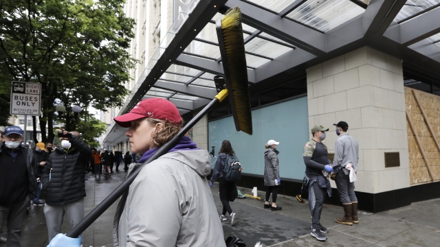 Volunteer helps clean up damage in downtown Seattle